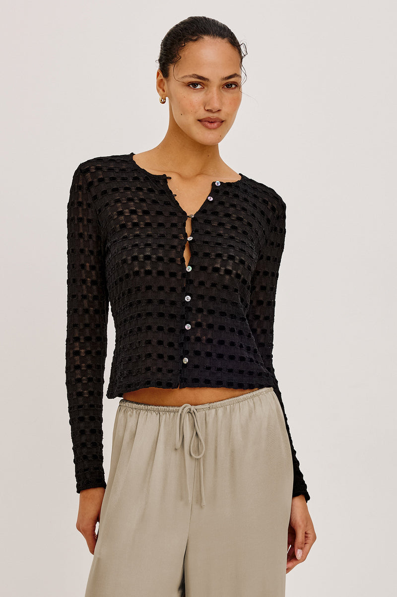 Cyrah Top in Black Checkerboard lace, front view on model