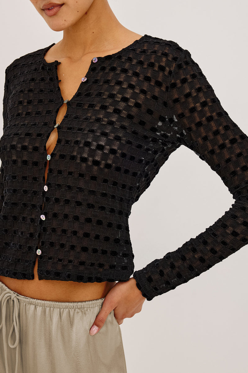 Cyrah Top in Black Checkerboard lace, front detail view on model