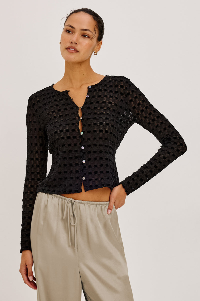 Cyrah Top in Black Checkerboard lace, front view on model